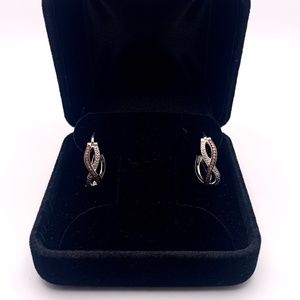 Rhodium two-tone swirl hoop earrings 1/8 tcw